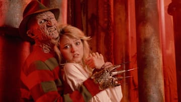 Freddy Krueger (Robert England) has Kirsten (Tuesday Knight) in his clutches in “A Nightmare on Elm Street 4: The Dream Master.”