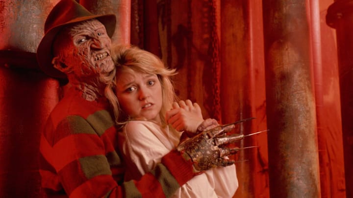 Freddy Krueger (Robert England) has Kirsten (Tuesday Knight) in his clutches in "A Nightmare on Elm Street 4: The Dream Master."