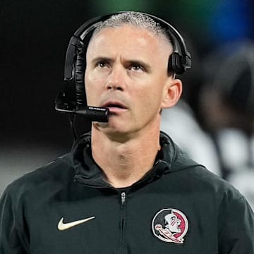 Dec 2, 2023; Charlotte, NC, USA;  Florida State Seminoles head coach Mike Norvell walks the sidelines during the third quarter against the Louisville Cardinals at Bank of America Stadium. Mandatory Credit: Jim Dedmon-Imagn Images