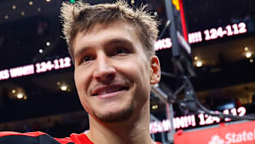 Bogdan Bogdanovic #15 of the Atlanta Hawks waves to fans after beating the New Orleans Pelicans.