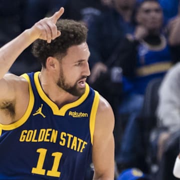 Nov 18, 2023; San Francisco, California, USA; Golden State Warriors guard Klay Thompson (11) reacts after he hit a three-point shot against the Oklahoma City Thunder during the first half at Chase Center. Mandatory Credit: John Hefti-Imagn Images