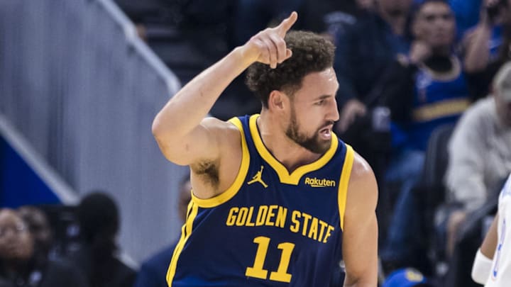 Nov 18, 2023; San Francisco, California, USA; Golden State Warriors guard Klay Thompson (11) reacts after he hit a three-point shot against the Oklahoma City Thunder during the first half at Chase Center. Mandatory Credit: John Hefti-Imagn Images