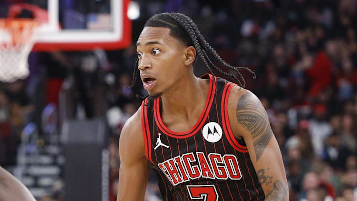 Feb 26, 2026; Chicago, Illinois, USA; Chicago Bulls guard Rob
Dillingham (7) brings the ball up court against Portland Trail Blazers guard Jrue Holiday (5) during the first half of an NBA game at United Center. Mandatory Credit: Kamil Krzaczynski-Imagn Images