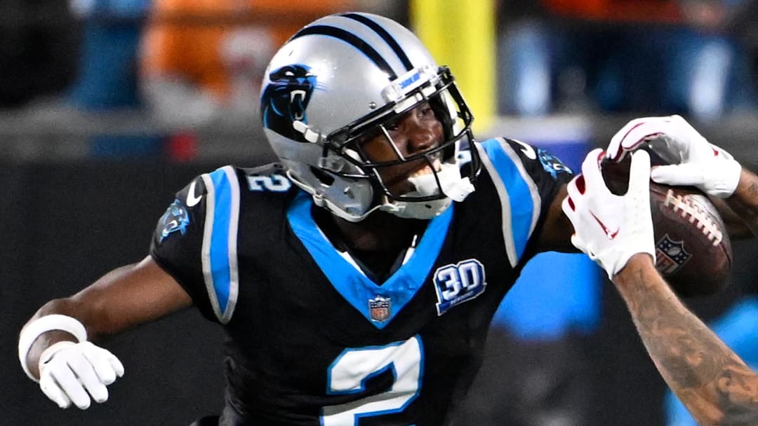 Dec 1, 2024; Charlotte, North Carolina, USA;  Tampa Bay Buccaneers wide receiver Mike Evans (13) catches the ball as Carolina Panthers cornerback Michael Jackson (2) defends in overtime at Bank of America Stadium. Mandatory Credit: Bob Donnan-Imagn Images