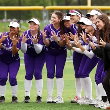 The Sunset softball team is all smiles after Thursday’s 3-2 eight-inning win over McNary.