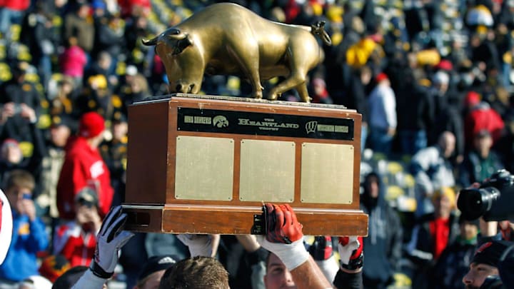 The Badgers hoist the Heartland trophy after the Badgers 28-9 win over Iowa on November 2, 2013, in Iowa City, Iowa. The Badgers hoist the Heartland trophy after the Badgers 28-9 win over Iowa on November 2, 2013, in Iowa City, Iowa.