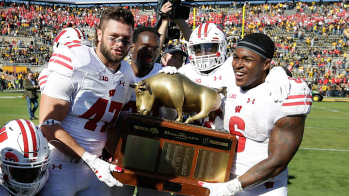 Wisconsin Badgers linebacker Vince Biegel (47) and running back Corey Clement hold the Heartland trophy in the rivalry after Wisconsin's 17-9 win over Iowa at Kinnick Stadium in Iowa City, Iowa, on October 22, 2016. The Badgers won 17-9. Wisconsin Badgers linebacker Vince Biegel (47) and running back Corey Clement hold the Heartland trophy in the rivalry after Wisconsin's 17-9 win over Iowa at Kinnick Stadium in Iowa City, Iowa, on October 22, 2016. The Badgers won 17-9.