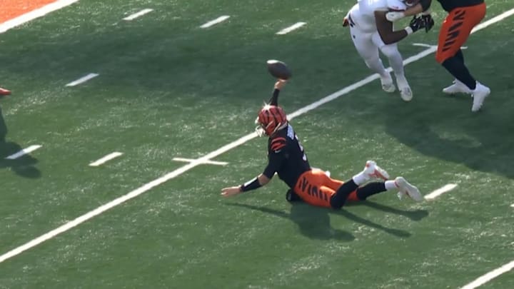 Burrow hit Tee Higgins in the end zone for a touchdown after falling down. Burrow hit Tee Higgins in the end zone for a touchdown after falling down.