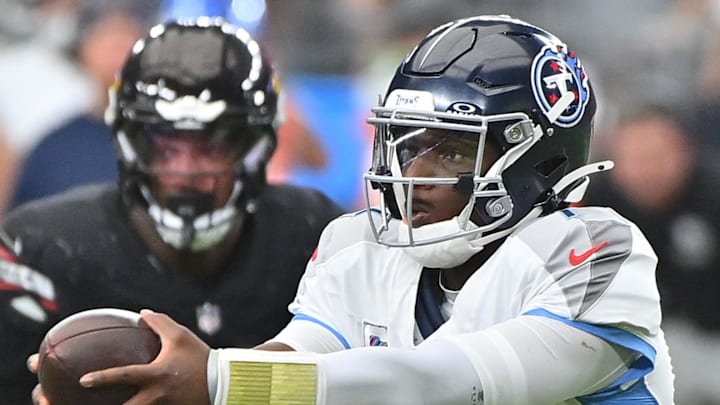 Tennessee Titans quarterback Cam Ward fakes a handoff against the Arizona Cardinals. Tennessee Titans quarterback Cam Ward fakes a handoff against the Arizona Cardinals.