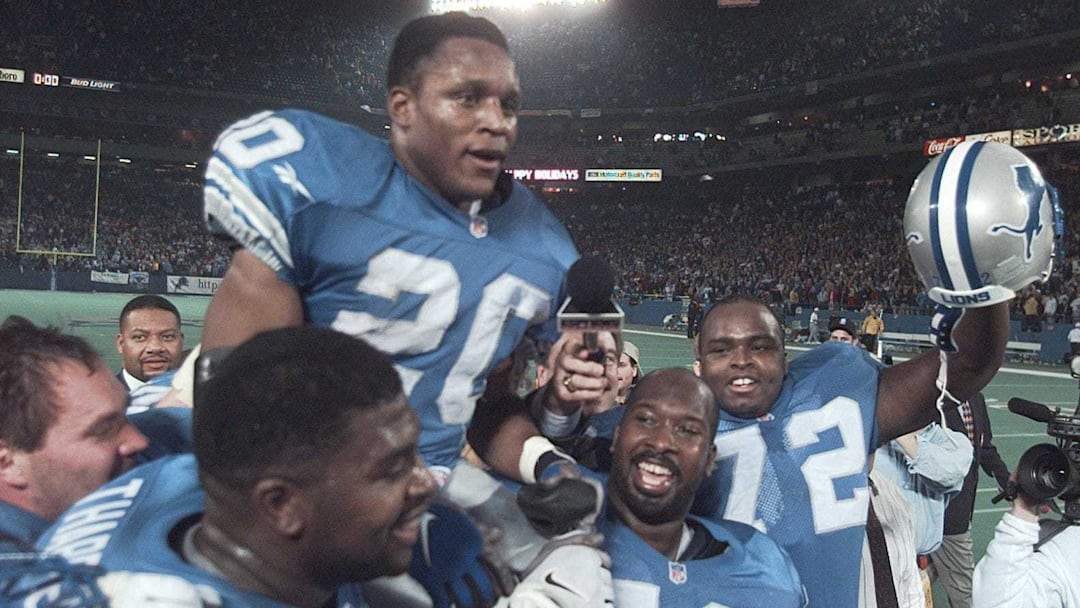 Detroit Lions running back Barry Sanders is carried on the shoulders of teammates after reaching the 2,000-yard milestone in 1997.