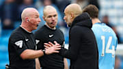 Pep Guardiola (right) was not impressed with Simon Hooper's leniency on Saturday