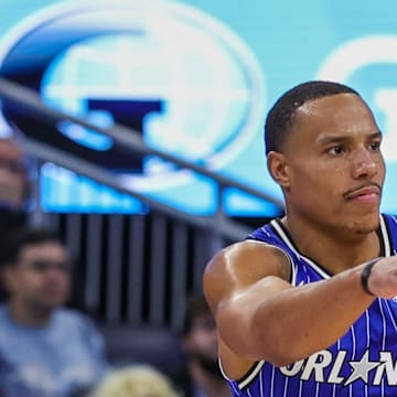 Orlando Magic guard Desmond Bane passes the ball in front of Boston Celtics guard Derrick White.