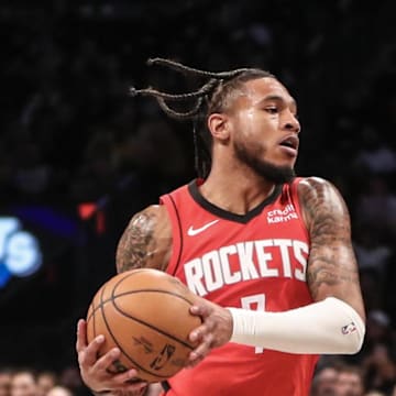 Jan 27, 2024; Brooklyn, New York, USA;  Houston Rockets forward Cam Whitmore (7) looks to drive past Brooklyn Nets guard Dennis Smith Jr. (4) in the fourth quarter at Barclays Center. Mandatory Credit: Wendell Cruz-Imagn Images