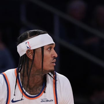 New York Knicks guard Jordan Clarkson dribbles against Washington Wizards guard/forward Justin Champagnie.