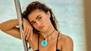Rayna Vallandingham was photographed by Yu Tsai in Jamaica. Necklace by Ben-Amun. 