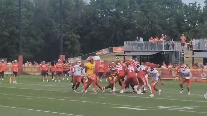 Patrick Mahomes throwing the ball behind his back.