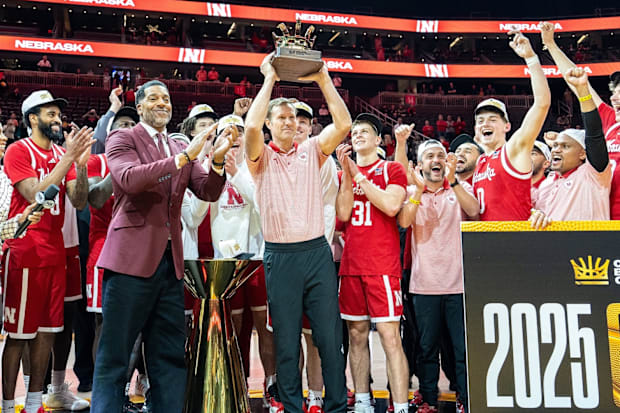 Nebraska coach Fred Hoiberg holds up the College Basketball Crown trophy after the Huskers beat UCF in the championship game.
