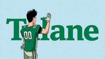 Tulane football player waves goodbye to Tulane