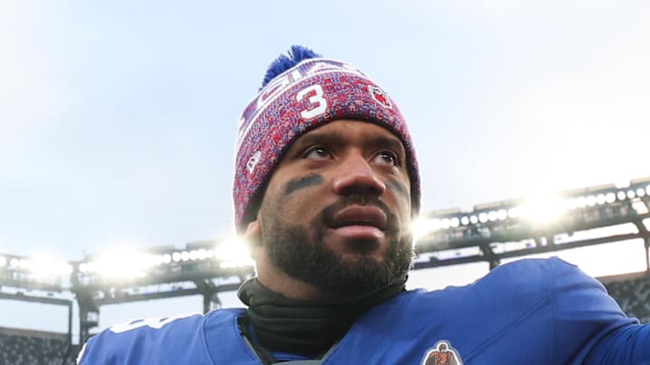 Former Seattle Seahawks quarterback Russell Wilson waves to fans