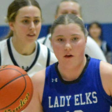 Elkton-Lake Benton's Sydney DeVries heads down the court against Great Plains Lutheran's Kate Holmen during their Region 2A girls basketball game on Feb. 25, 2025.