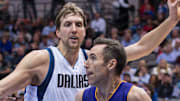 Former Los Angeles Lakers guard Steve Nash drives to the basket past Dallas Mavericks forward Dirk Nowitzki in a game.