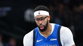 Dallas Mavericks forward Anthony Davis reacts in fron tof Miami Heat guard Pelle Larsson.