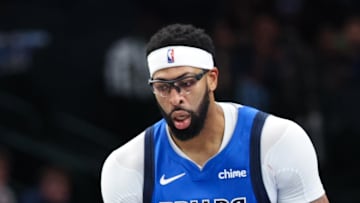 Dallas Mavericks forward Anthony Davis reacts in fron tof Miami Heat guard Pelle Larsson.