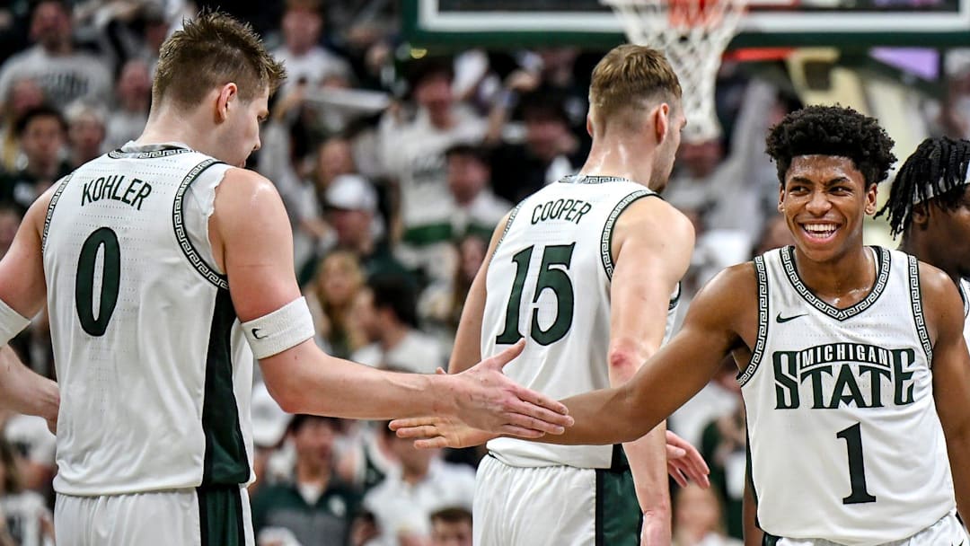 Michigan State's Jeremy Fears Jr., right, celebrates during a timeout against UCLA in the first half on Tuesday, Feb. 17, 2026, at the Breslin Center in East Lansing.