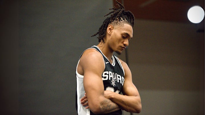 Sep 30, 2024; San Antonio, Texas, USA; San Antonio Spurs shooting guard Devin Vassell (24) poses for a photo shoot during the team's Media Day at Victory Capital Performance Center. Sep 30, 2024; San Antonio, Texas, USA; San Antonio Spurs shooting guard Devin Vassell (24) poses for a photo shoot during the team's Media Day at Victory Capital Performance Center.