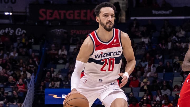 Feb 14, 2024; New Orleans, Louisiana, USA;  Washington Wizards guard Landry Shamet (20) brings the ball up court against New Orleans Pelicans forward Naji Marshall (8) during the first half at Smoothie King Center. Mandatory Credit: Stephen Lew-USA TODAY Sports