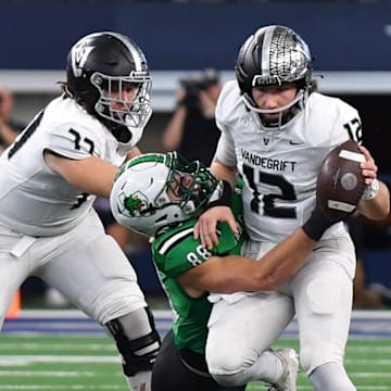 Southlake Carroll's Cody Williford tackles Austin Vandegrift's Miles Teodecki during the 6A DII UIL Texas State Football Championship game on Saturday, December 21, 2024, at AT&T Stadium in Arlington.