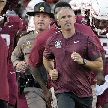 Sep 21, 2024; Tallahassee, Florida, USA; Florida State Seminoles head coach Mike Norvell leads his team out of the tunnel before the game against the California Golden Bears at Doak S. Campbell Stadium. Mandatory Credit: Melina Myers-Imagn Images