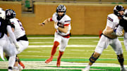 Allen quarterback Jeremiah Daoud runs through an opening for a first down in a Class 6A Division I playoff game against North Crowley on Friday in Denton.