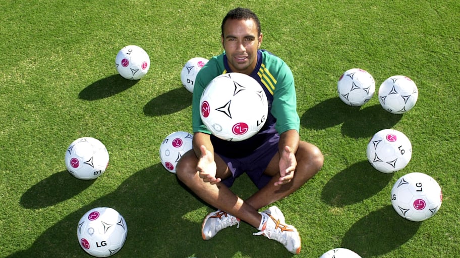 Archie Thompson with his 13 match balls after scoring 13 against American Samoa.