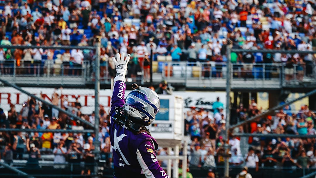 Tyler Reddick raises four fingers in the air toward the crowd at Darlington Raceway after collecting his fourth win of the season in Sunday's NASCAR Cup Series Goodyear 400 at Darlington.