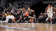 Nate Calmese dribbles ball up the court for the Deacs against Michigan 