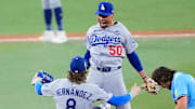 Kiké Hernández and Mookie Betts celebrate the Dodgers’ game-ending double play in the ninth inning Friday night.