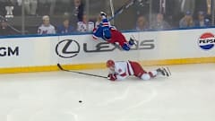 Jacob Trouba flies headfirst into the boards