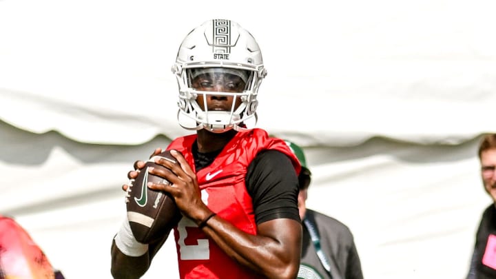 Michigan State quarterback Aidan Chiles looks to throw during the first day of football camp on Tuesday, July 30, 2024, in East Lansing.