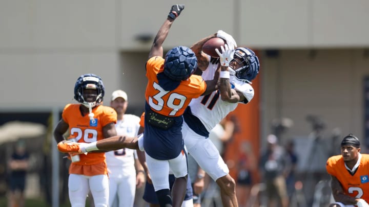 Denver Broncos cornerback Levi Wallace (39) attempts to break up a pass to wideout Josh Reynolds (11) during training camp practice. 