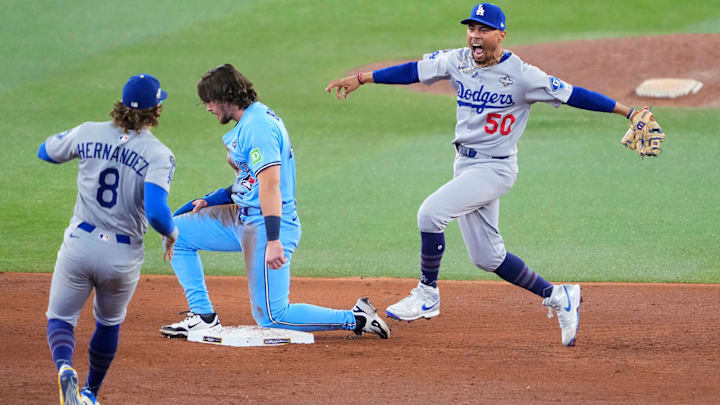 Mookie Betts and Enrique Hernández celebrate the Dodgers’ game-ending double play to force a Game 7. Mookie Betts and Enrique Hernández celebrate the Dodgers’ game-ending double play to force a Game 7.