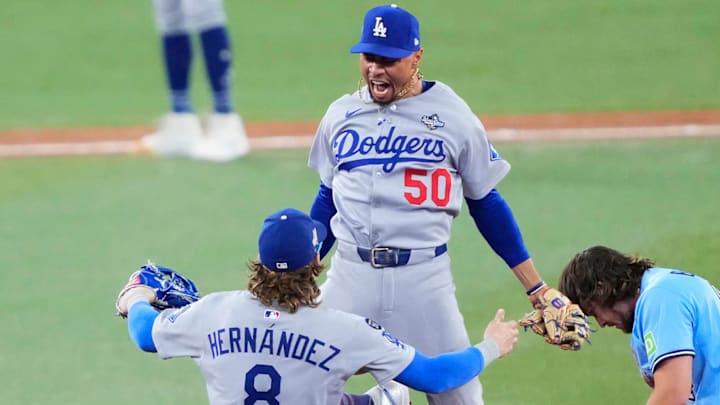 Kiké Hernández and Mookie Betts celebrate the Dodgers’ game-ending double play in the ninth inning Friday night.