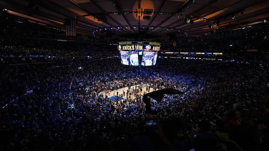 Knicks fans celebrate after Game 4, lingering long after the final horn.
