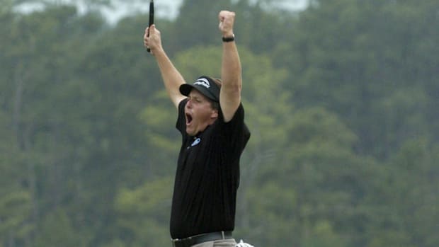 Phil Mickelson celebrates winning the 2004 Masters on the 18th green Sunday April 11, 2004 at Augusta National