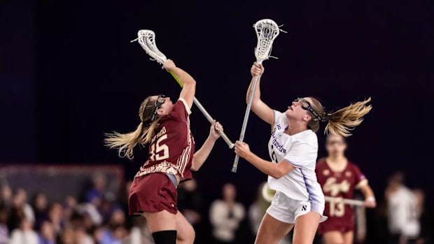 Boston College's Abby Herrod and Northwestern's Sam Smith vie for a draw control in a lacrosse game on February 15, 2025.