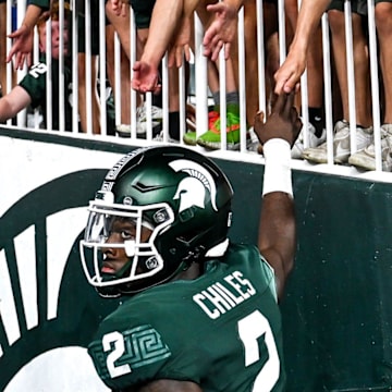 Michigan State's Aidan Chiles slaps hands of fans after after the game against Florida Atlantic on Friday, Aug. 30, 2024, at Spartan Stadium in East Lansing.