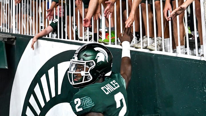 Michigan State's Aidan Chiles slaps hands of fans after after the game against Florida Atlantic on Friday, Aug. 30, 2024, at Spartan Stadium in East Lansing.