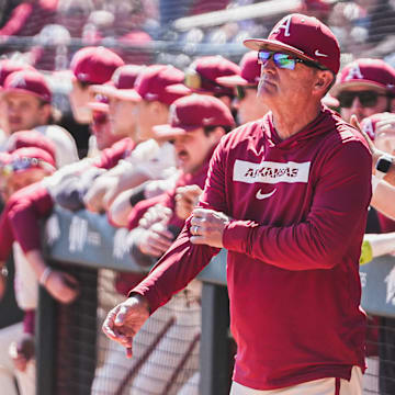 Arkansas coach Dave Van Horn looks on from the dugout against the Portland Pilots. The Razorbacks won the third game of the series 5-3. 