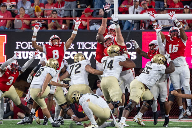 Nebraska defensive lineman Ty Robinson blocks a kick from Colorado's Alejandro Mata during the second quarter.