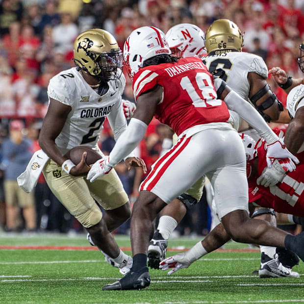 Nebraska linebacker Princewill Umanmielen gets ready to sack Colorado quarterback Shedeur Sanders for a 6-yard loss.